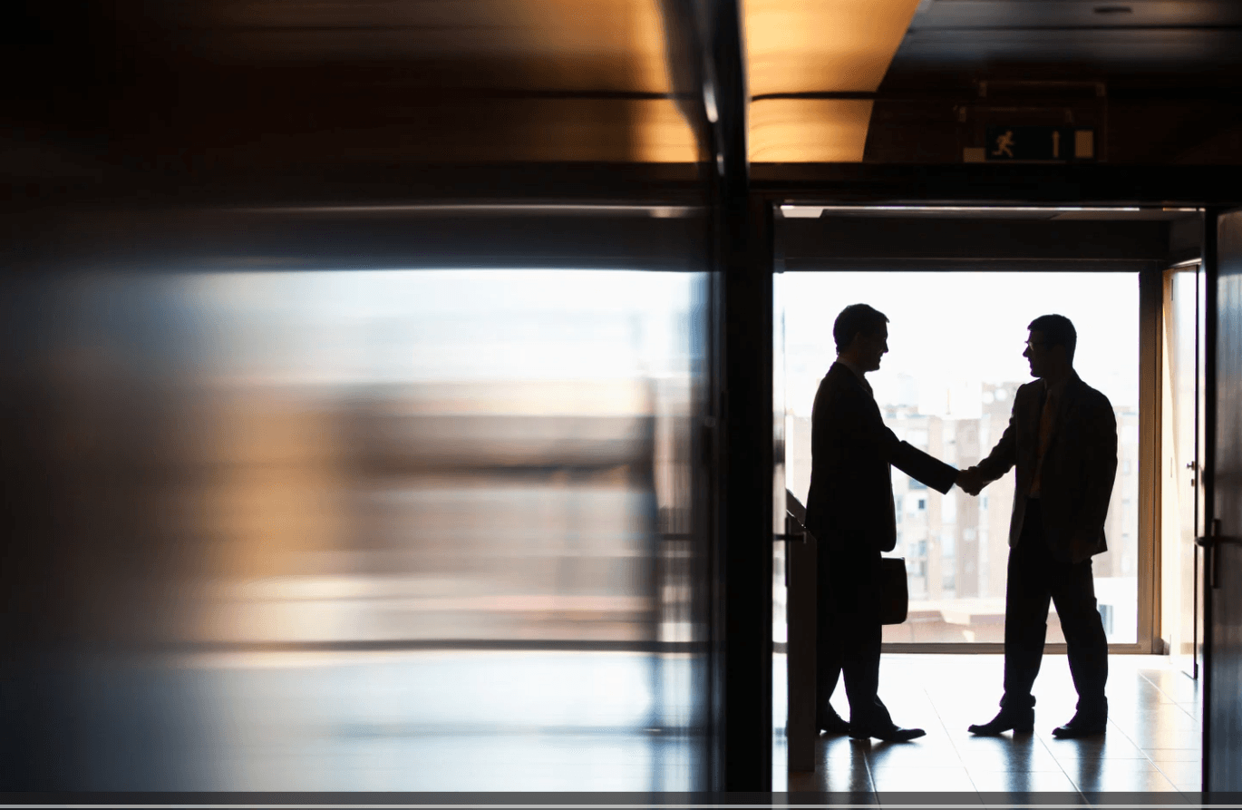 Business partnership handshake representing collaboration